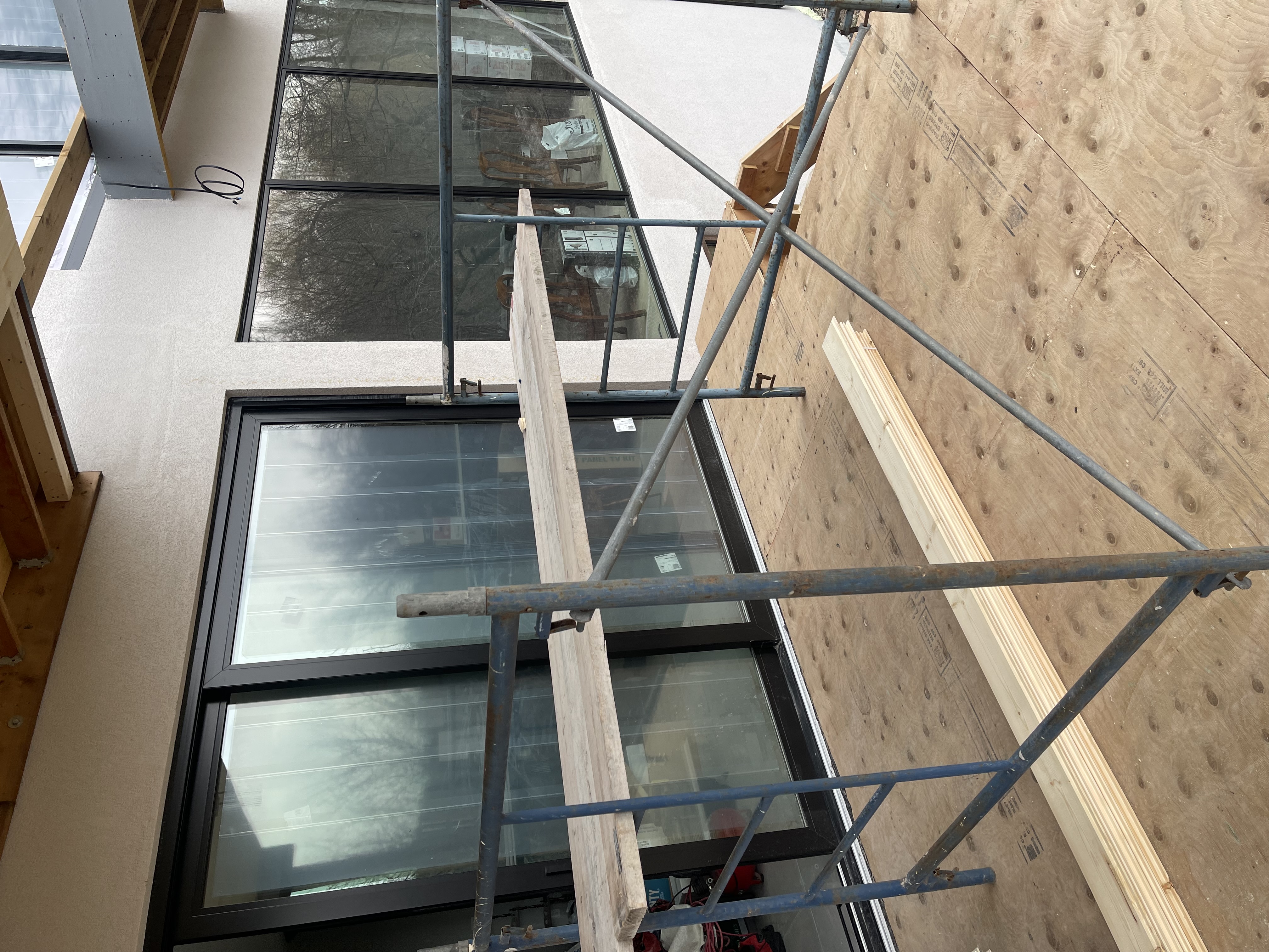 Exterior glass railing staircase renovation by Aries Home Improvement Inc.